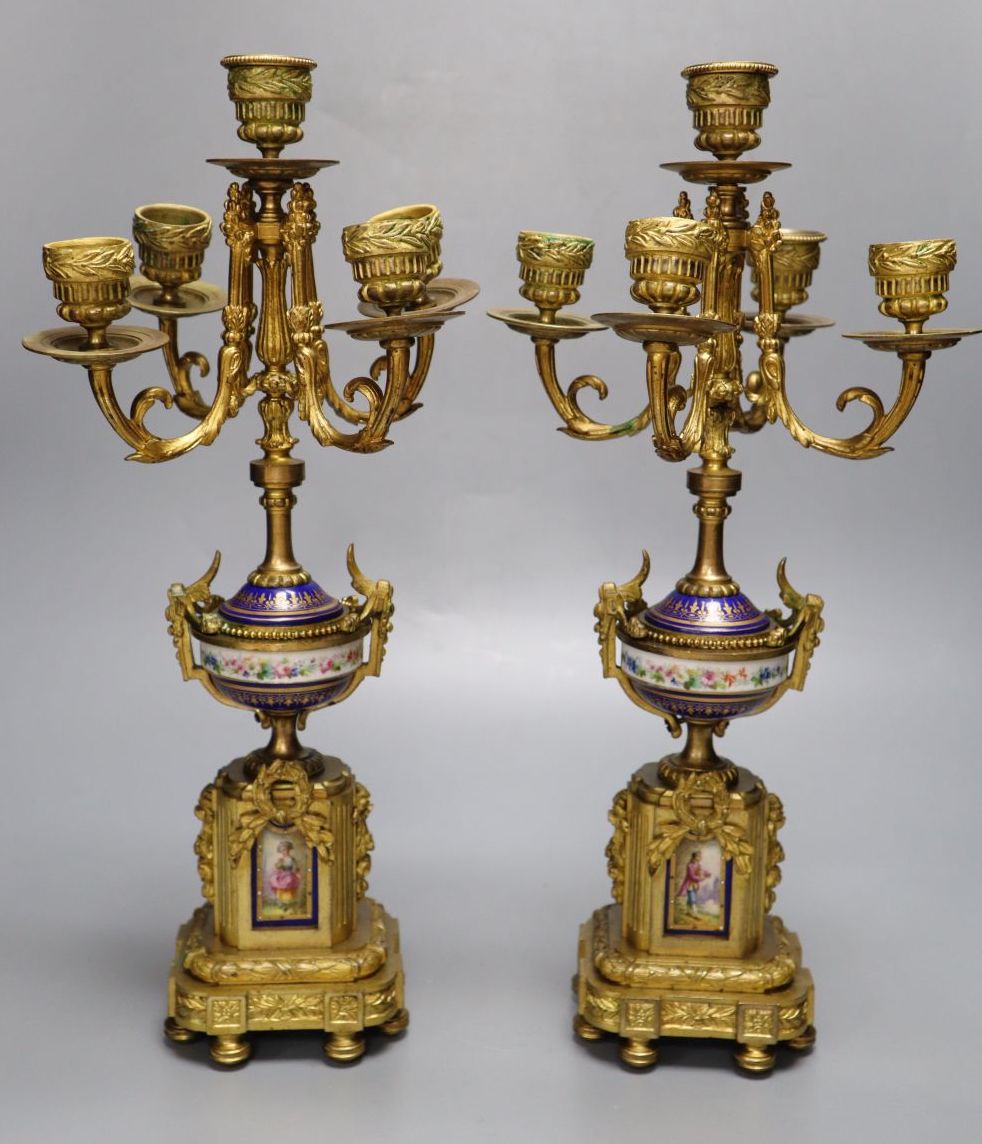 A pair of 19th century French ormulu and porcelain five light candelabra, mounts in the style of Sevres, 38cm